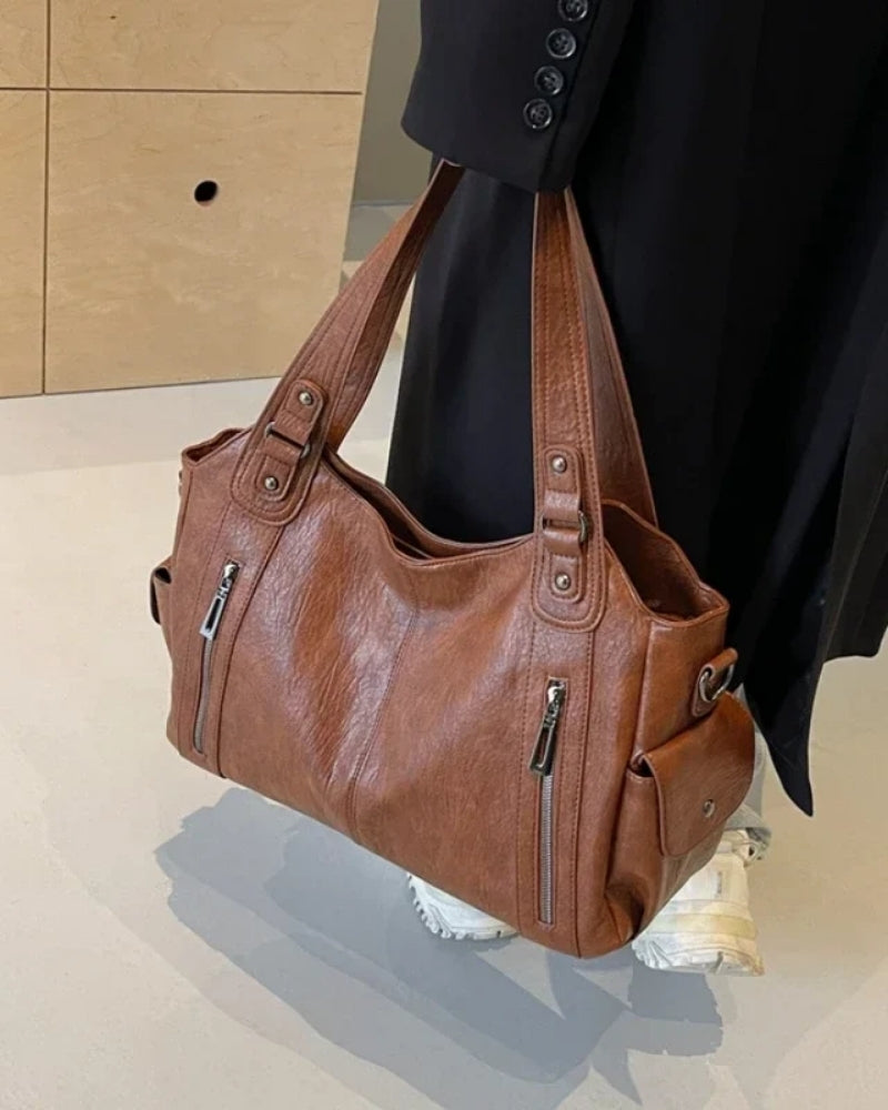 Dame- skuldertaske – rummelig og stilfuld med justerbar rem