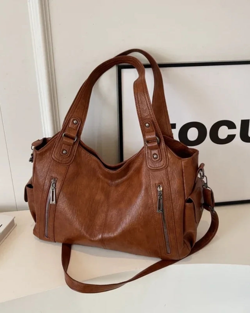 Dame- skuldertaske – rummelig og stilfuld med justerbar rem