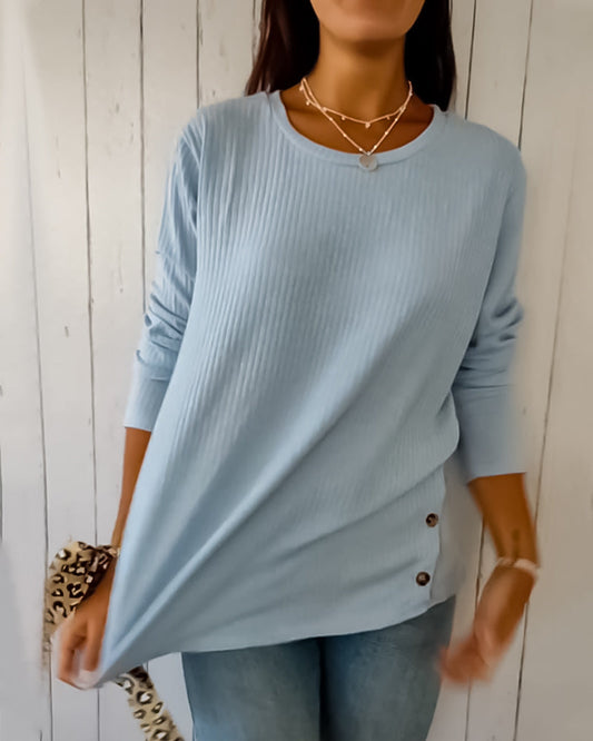 Elegant, strikket top med lange ærmer og rund hals