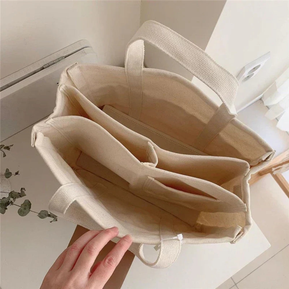 Stor canvas skuldertaske - Crossbody-design med praktiske rum