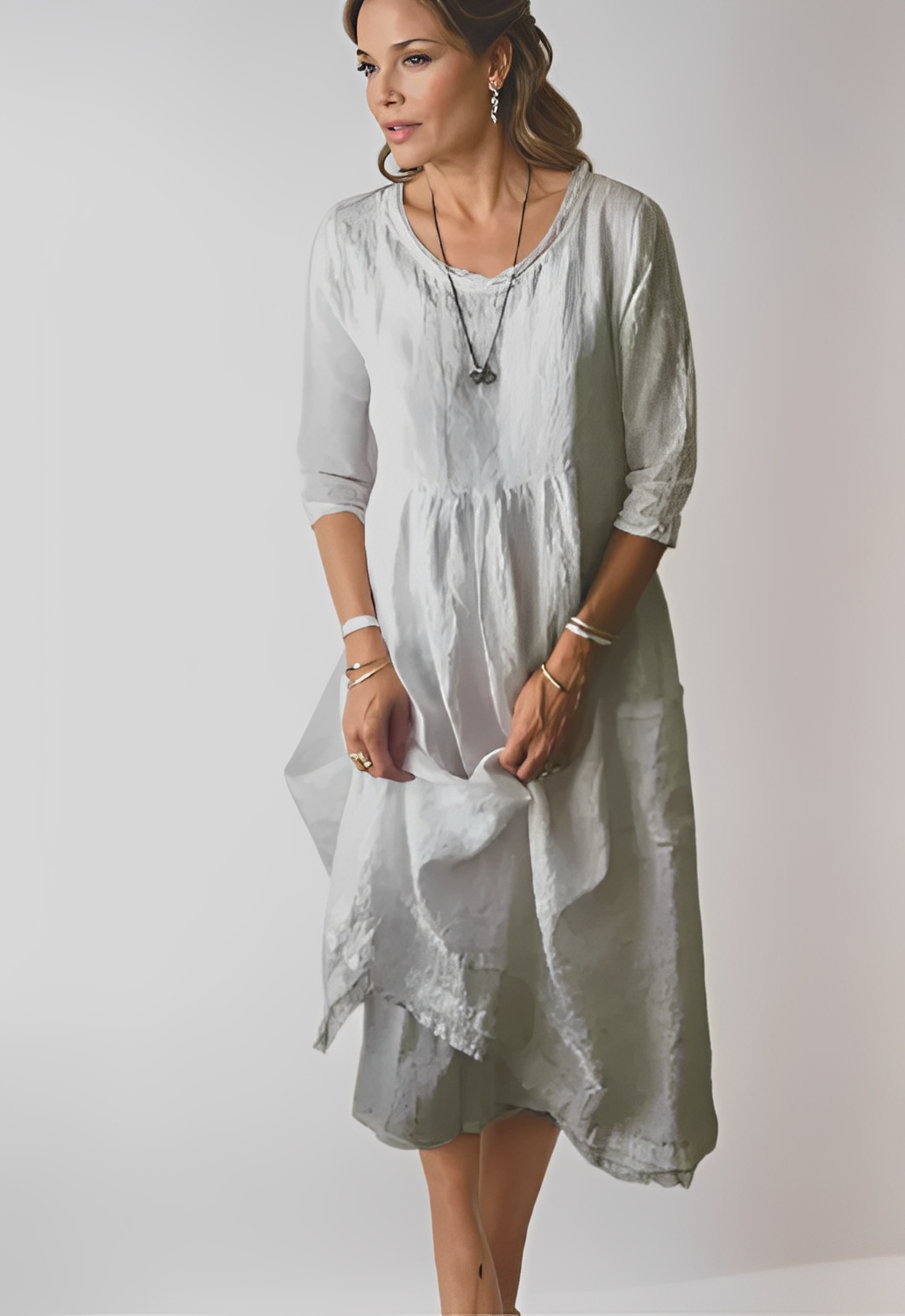 Livia - Ett elegant och avslappnat klänning med 3/4-ärmar