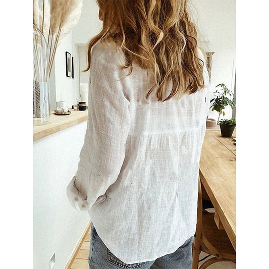 Elegant Blus med V-ringning och Unika Knappdetaljer