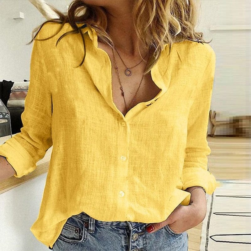 Elegant Bluse med V-Hals og Unikke Knapdetaljer